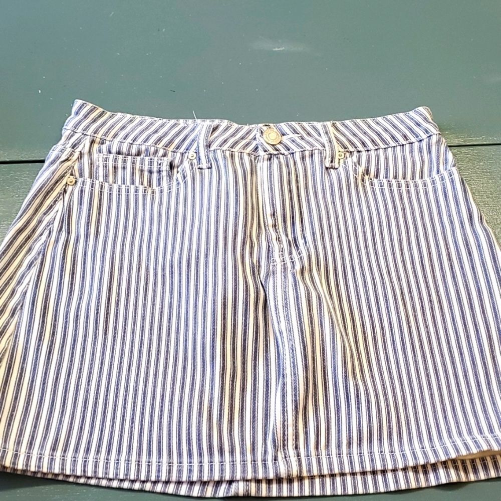 Denim striped mini skirt. Size 9. 5 pockets. By Indigo Rein. Good used …